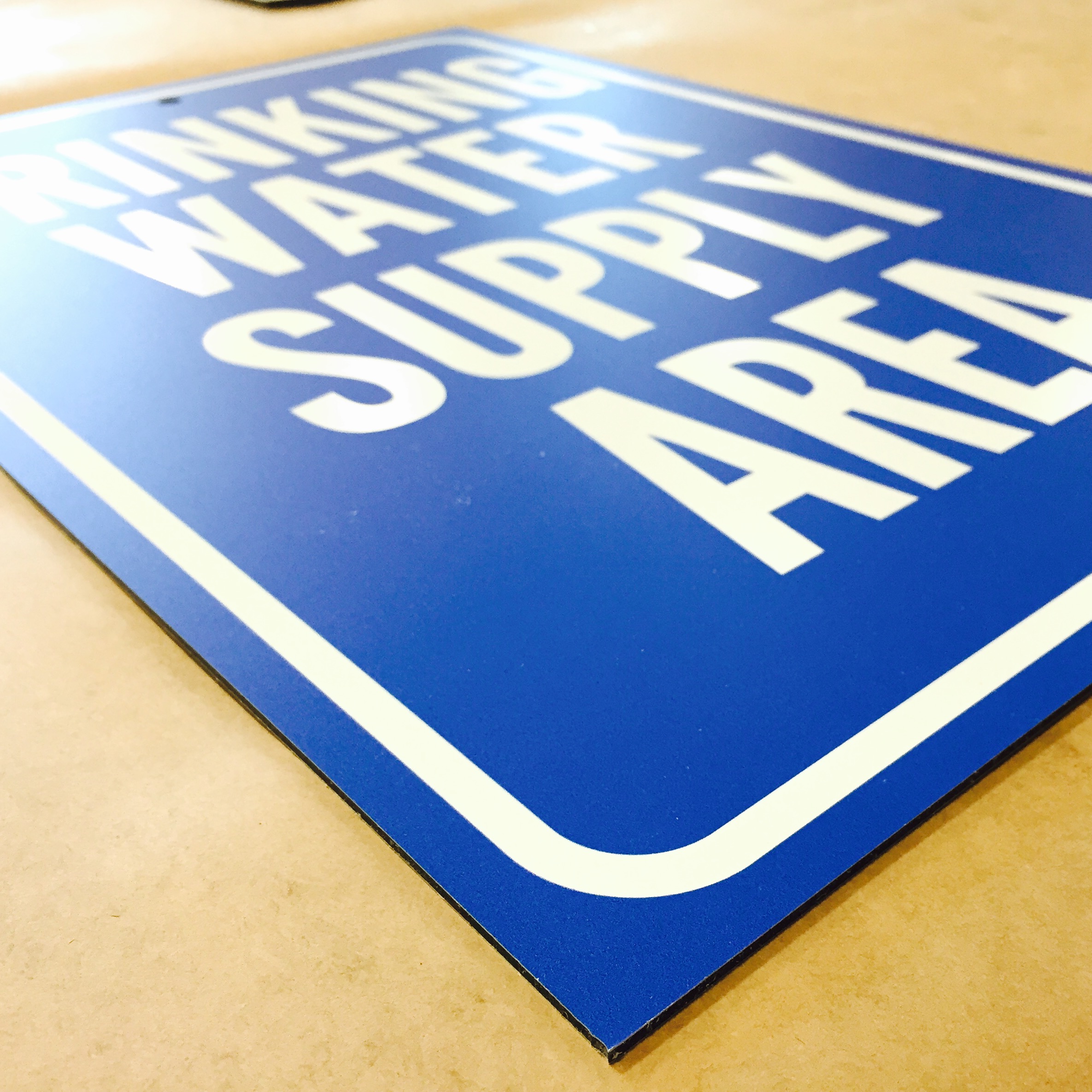 Standard vs. Brushed Aluminum Signage 101