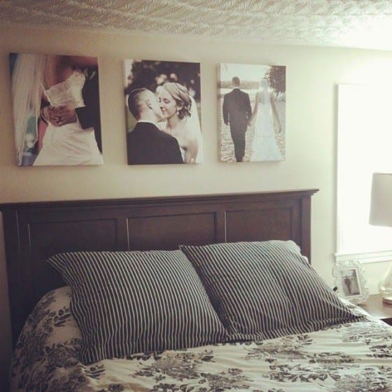 wedding prints above bedframe