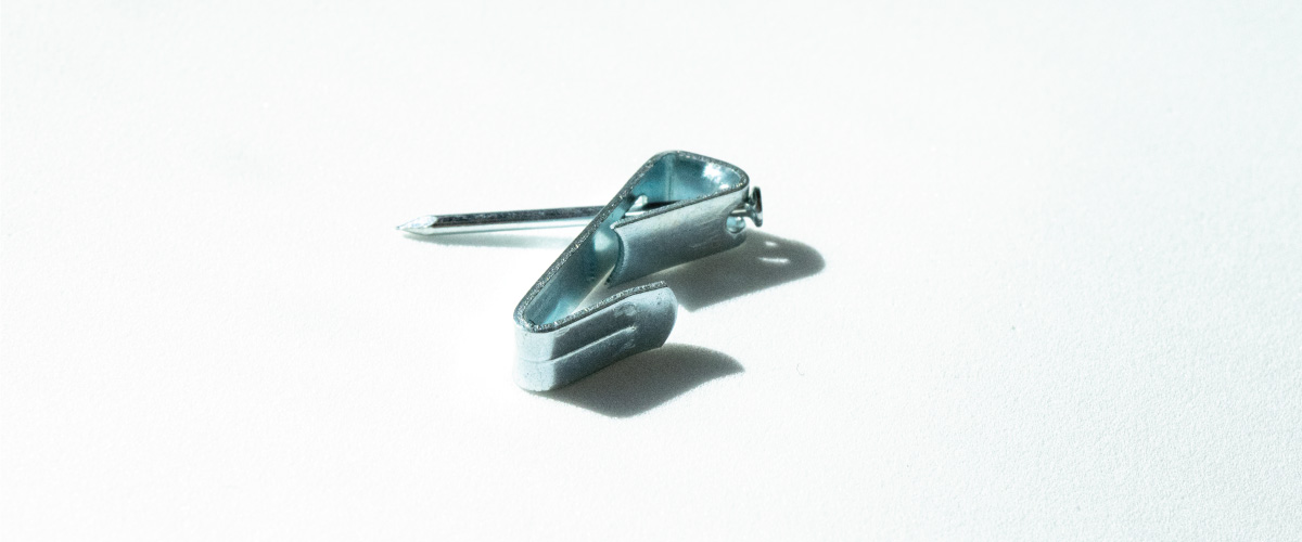 Nail and Hook which are used specifically for hanging a picture with a wire hanging kit.