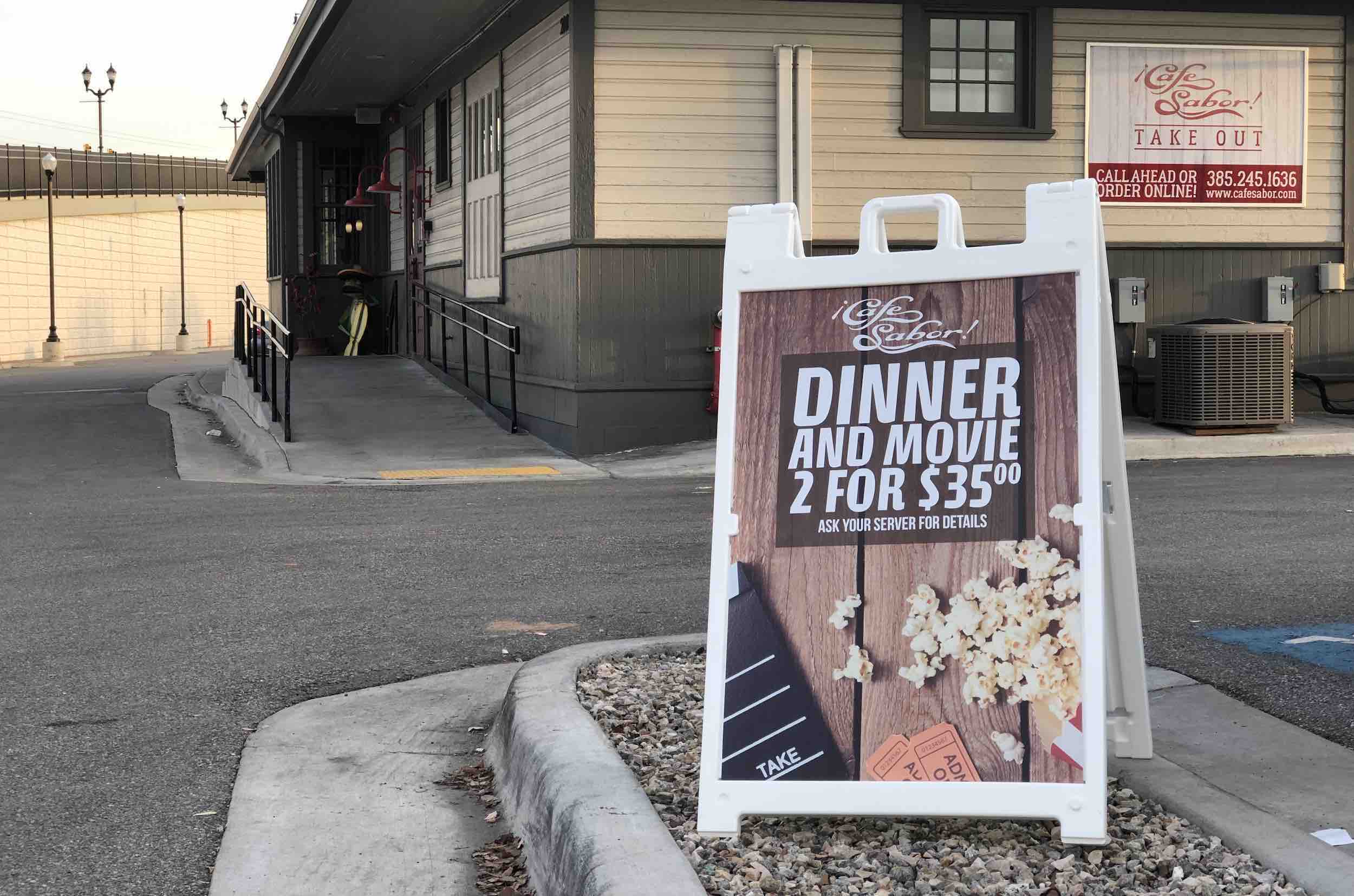 A frame sign in front of business