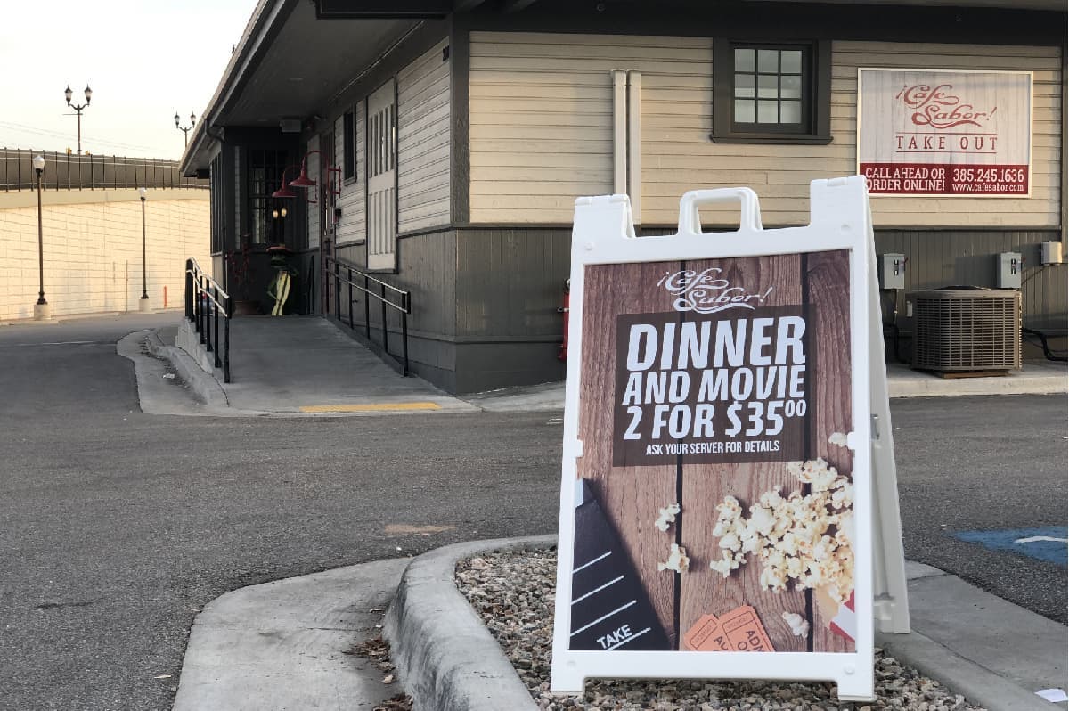 A-frame sign promoting special offer outside of store entrance