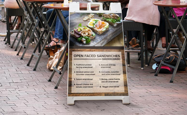 White plastic a frame open faced sandwiches menu graphic alfresco dining background